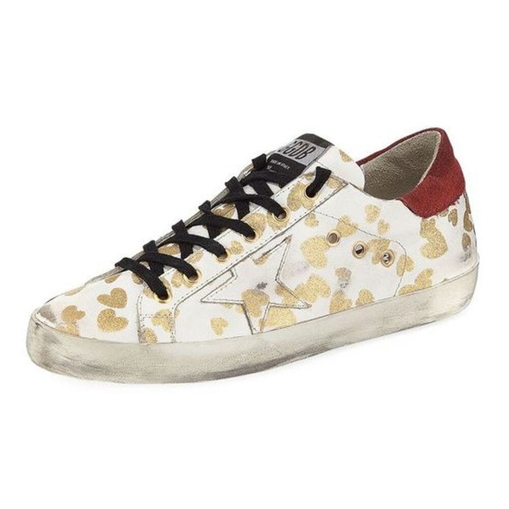 Golden Goose White Sneaker with Gold Heart Accents and Red Heel